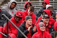 Ohio State Buckeyes offensive players, including Jeremiah Smith, left, and Carnell Tate, right, watch during the Ohio State Buckeyes College Football Playoff national championship celebration at Ohio Stadium - Source: Imagn